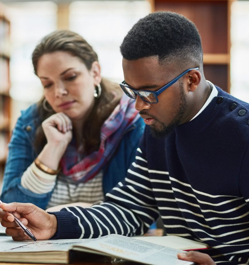 Theres always something new to learn. a group of university students working in the library at campus